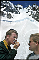 two climbing partners applying zinc oxide on the Hogsback of Mt. Hood on the classic
South Side Route.